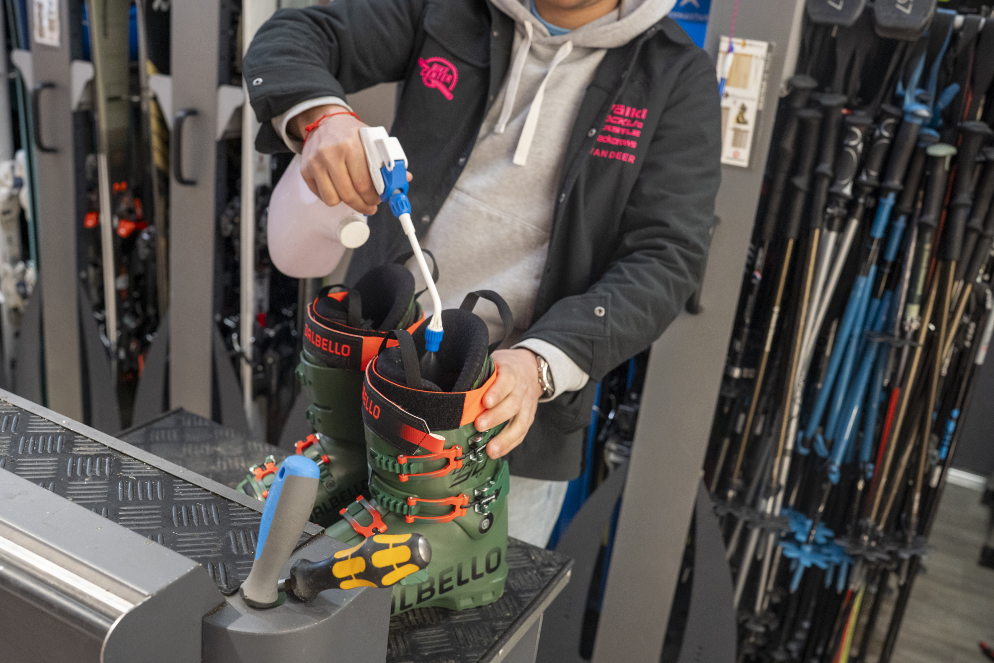 Spraying NST Fresh product into Dalbello ski boots